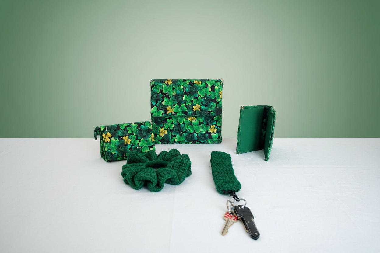 The whole Saint Patrick Clover Leaf set. A clutch purse, two wallets, a scrunchie, and. key bracelet.