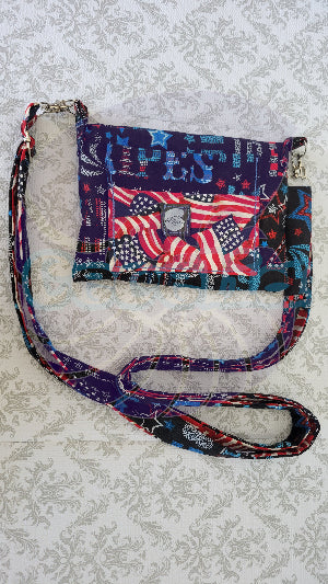 Multicolored patterned crossbody bag with American flag design on a textured surface