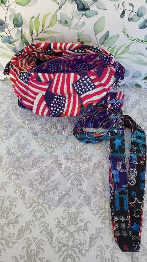Multicolored fabric crossbody purse with American flag pattern on a textured gray background. Inside you find more of the american flag and see inside the purse to find a one or two.