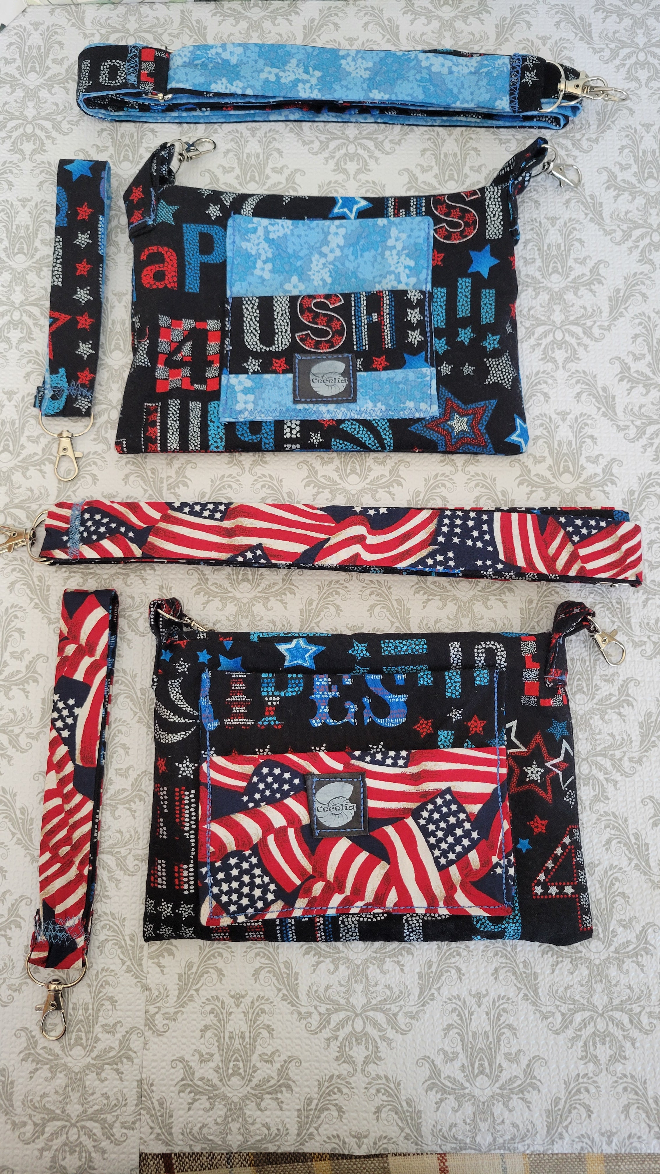 Set of patterned clutch purses with American flag design on a textured surface